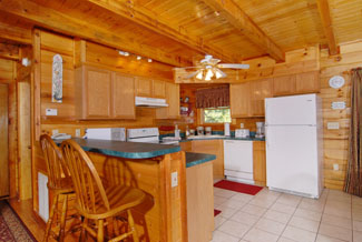 Pigeon Forge Cabin Featuring a Fully Equipped Kitchen with Breakfast Bar Seating